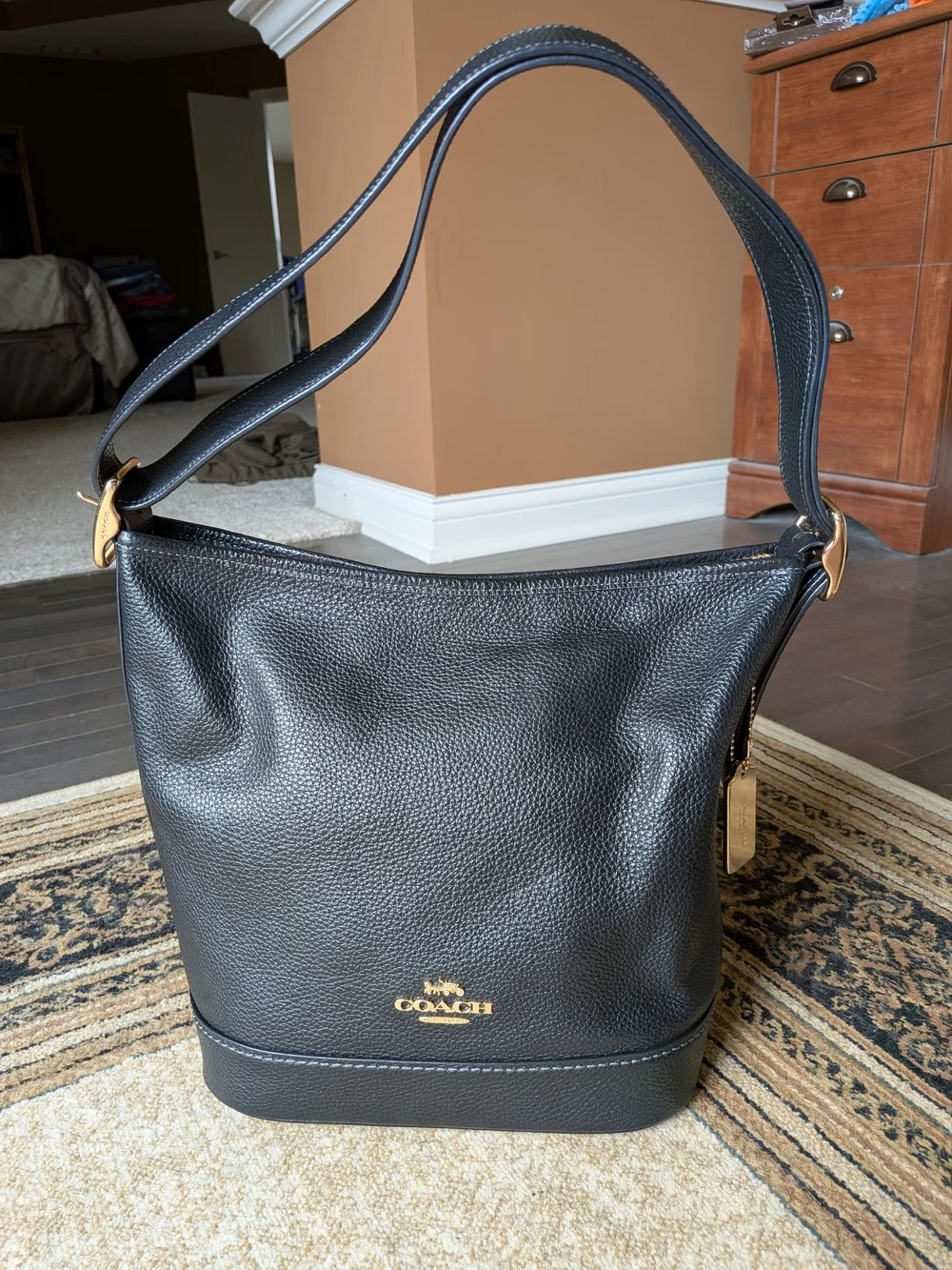 Coach Jude Duffel Bag in Black Pebbled Leather with Gold Hardware